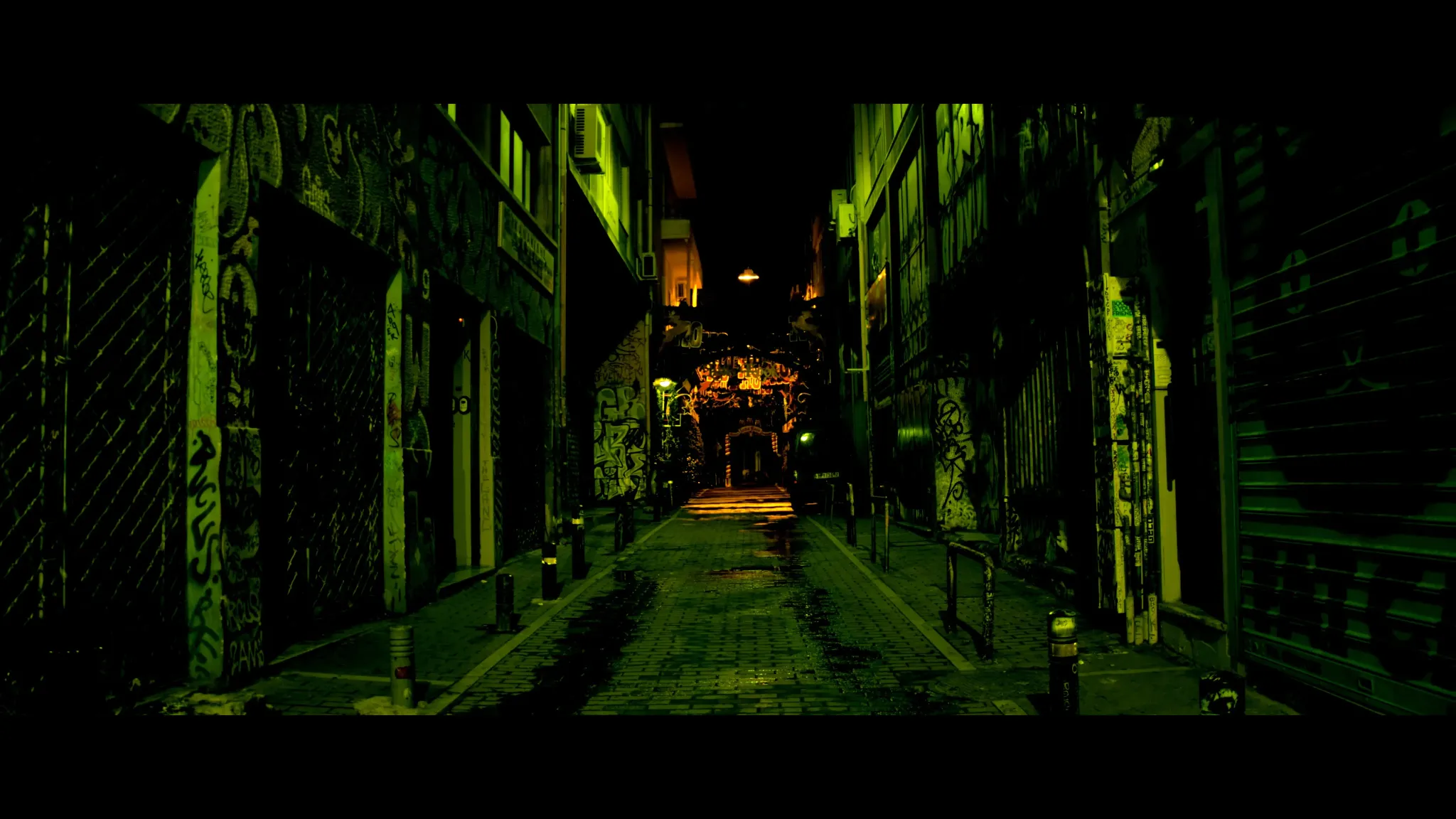 Afternight still of green-lit alley at night