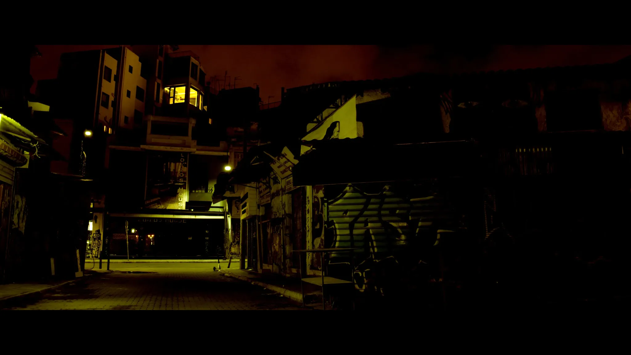 Afternight still of red-sky urban street at night